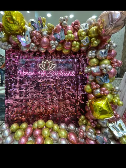 An angled view of the store decoration, showing the depth and texture of the balloon arrangement.