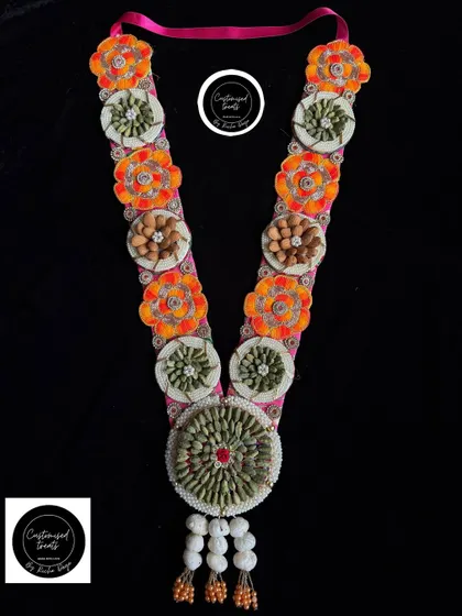 Another variation of my popular elaichi and almond garland, this one with bright orange floral details.