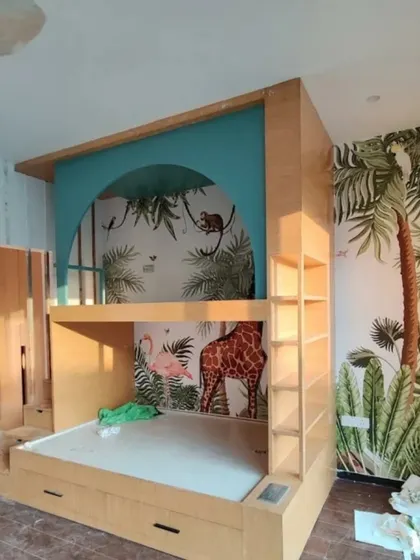 A creative bunk bed setup integrated with a jungle-themed wallpaper, turning the sleeping area into a fun, multi-level treehouse.