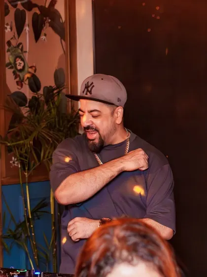 Feeling the beat and moving with the crowd. A candid shot of me getting into the groove during a VIBE CHECK set.
