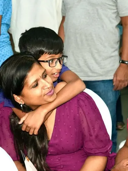 A sweet moment between a mother and her son.