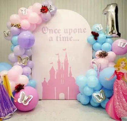 A 'Once upon a time' princess-themed first birthday with Rapunzel and Aurora cutouts.