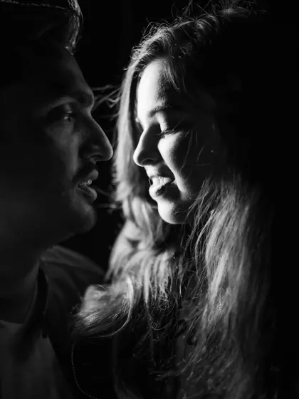 An intimate black and white close-up that captures the quiet conversation between a couple. By removing color, we draw focus to the emotion and connection in their expressions during their Shimla pre-wedding shoot.