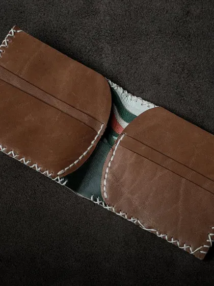 Another view of a handmade leather wallet, demonstrating the practical and beautiful items you can create with a simple set of tools and a piece of leather.