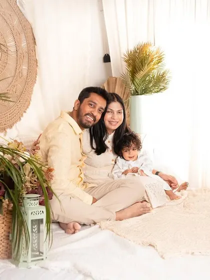 A beautiful family of three enjoying a quiet moment together in the studio. It's so important for parents to be in the photos too.