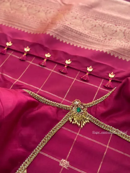 The back of a magenta blouse, showing the unique neckline and tassels. While the body may be silk, the velvet sleeves in other designs show my love for the fabric.