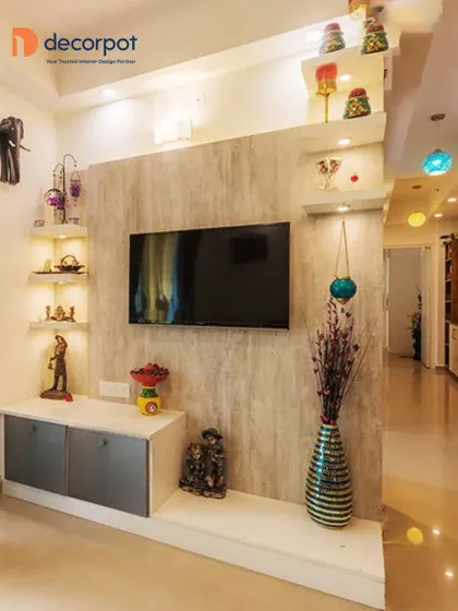 This compact TV unit is perfect for smaller spaces. The simple wall-mounted console is paired with decorative corner shelves, providing storage and display space without overwhelming the room.