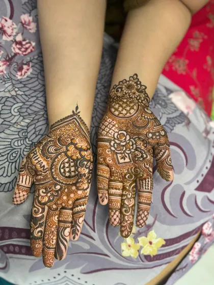 A non bridal design with the name 'Rihan' personalized on the palm. The rest of the design is a beautiful mix of traditional patterns.