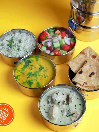 A light and creamy white chicken curry, paired with dal, rice, roti, and a refreshing salad. This meal is perfect for those who prefer milder, yet deeply flavorful dishes.