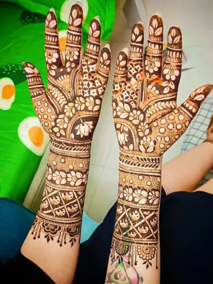 The lotus flower is a powerful symbol of purity and beauty. I have incorporated lotus motifs into the palms of this full-coverage bridal design.
