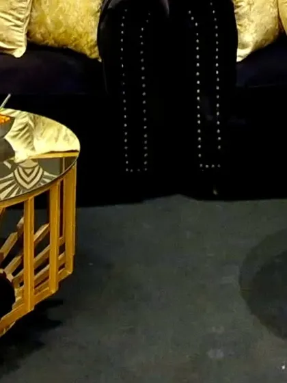 The combination of plush velvet sofas and bespoke gold-accented furniture creates a luxurious and comfortable lounge.