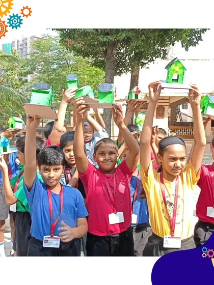 The pride and excitement are clear as these students show off their working solar-powered models.