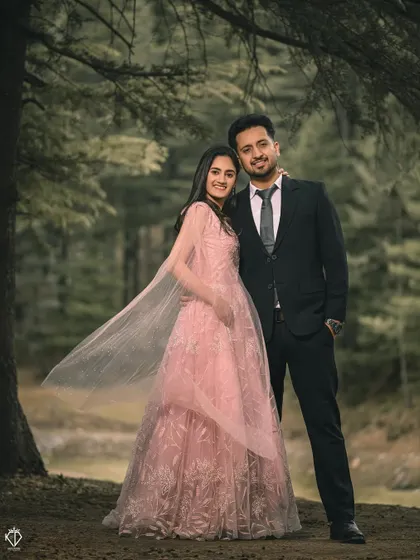 A classic portrait in the woods, with the flowing cape of her pink gown adding a touch of movement and elegance to the scene.