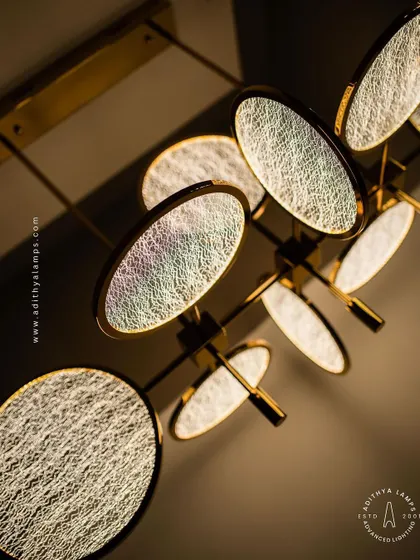 This artistic chandelier is composed of multiple circular discs with a unique woven texture. The layered arrangement and soft backlighting create a beautiful interplay of light and shadow, making it a captivating centerpiece.