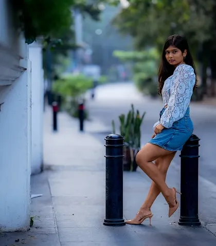 A wider angle of this street-side pose, showing how we can use the leading lines of the sidewalk to create a dynamic and engaging composition.