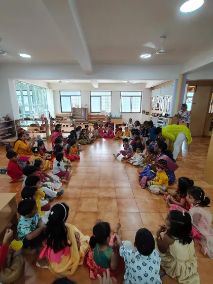 A large circle of children and teachers during our Janmashtami celebration. These gatherings build a strong sense of belonging and community.
