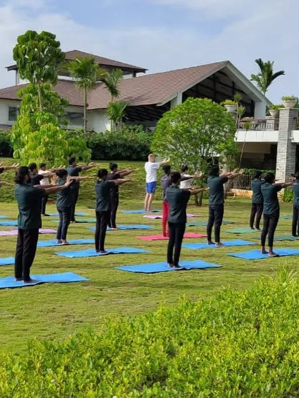 Another view of our staff yoga session, showing the community spirit and dedication to well-being that permeates our retreat.