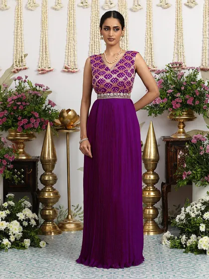 Another angle of the purple gown, showcasing its rich color and flowing silhouette.