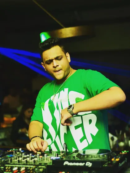 A fun shot of me mixing with a party hat on. While I take the music seriously, I always make sure we're having a good time.
