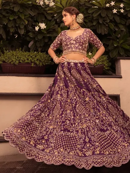 Presenting Noor. A majestic purple lehenga with intricate gold embroidery, for the bride who wants a unique and royal color.