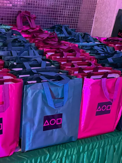 Themed return gift bags for the 'Squid Fiesta' party. I believe in a complete experience, which includes providing customized party favors that guests can take home as a memory of the fun event.