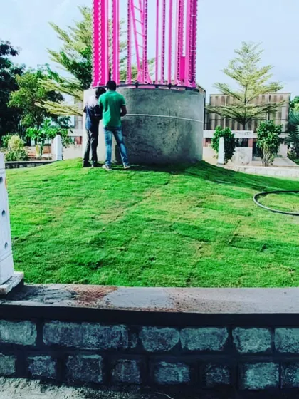 Laying Mexican grass on a sloped mound for a public landscaping project. This technique is often used for traffic islands and parks.