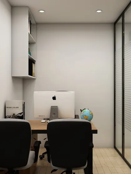 This rear view of the cabin's workspace highlights the clean, minimalist setup with a large monitor and an uncluttered desk, ideal for focused work. The glass wall maintains a connection to the larger office.