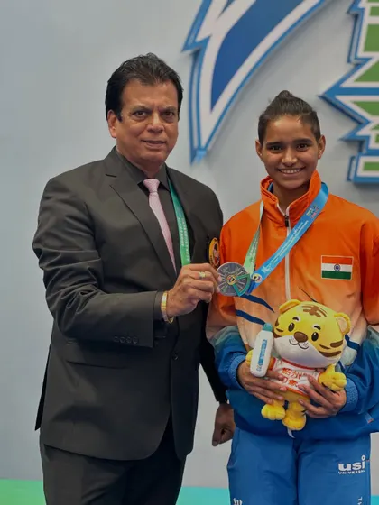 Presenting the silver medal to Ms. Rusha Tambat. Her performance at the Asian Karate Championship is an inspiration to all aspiring karateka in our program.