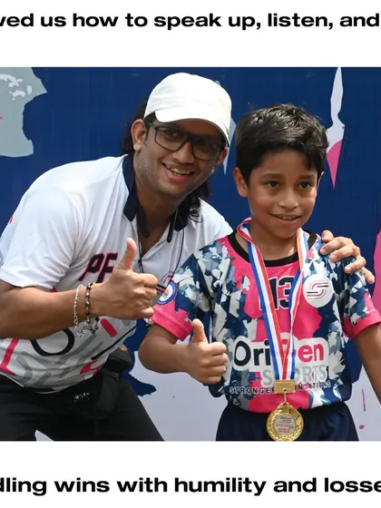 A coach celebrating a moment of success with a young player. These positive interactions build confidence and a strong player-coach relationship.