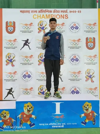 One of our warriors on the winner's podium at the Maharashtra State Olympic Games. This image captures the culmination of years of hard work and dedication.