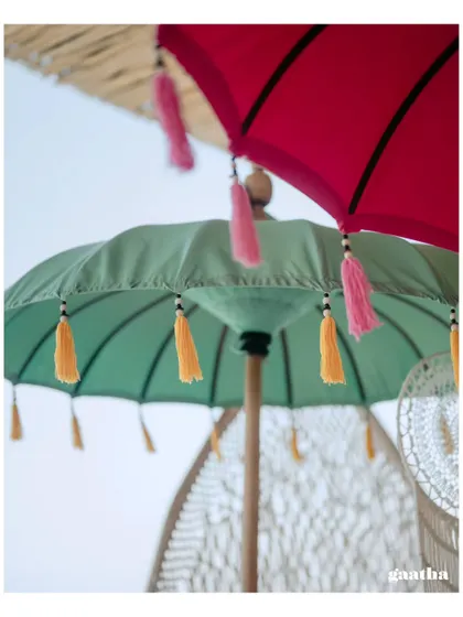 A detailed shot of the colorful tassels on the traditional Balinese umbrellas, a small detail that makes a big impact.