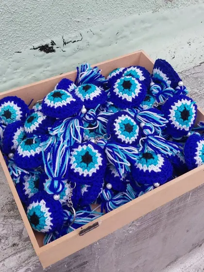 A box full of good vibes! These evil eye keychains are ready to be gifted and bring a smile to someone's face.