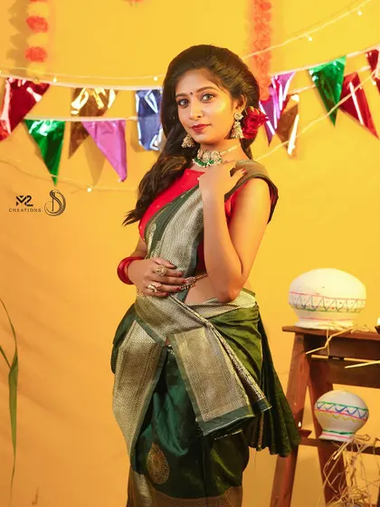 A modern take on a festive look. This model pairs a simple saree with a stylish choker, showing the versatility of my collection.