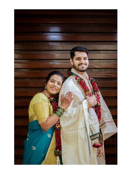 A classic portrait of the newly married couple in their beautiful South Indian wedding attire.