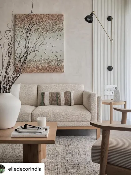 Our Zen House project featured in Elle Decor. This image highlights the modern but muted palette, with a layered rustic canvas of cane, natural fabrics, wood, and metal.