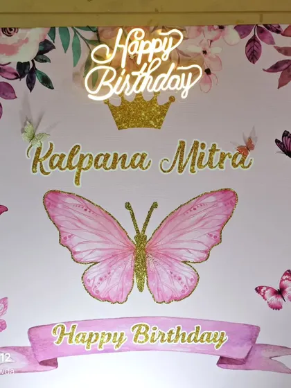 The personalized backdrop for this butterfly-themed birthday.