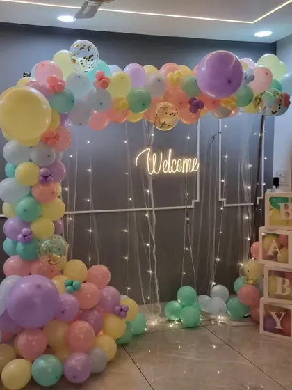 A full shot of the pastel welcome home balloon arch, perfect for brightening up any room.