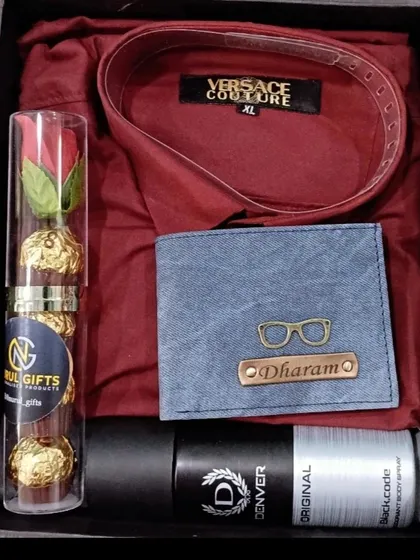 A festive gift hamper perfect for any celebration, this set includes a personalized denim wallet, a maroon shirt, deodorant, and chocolates.
