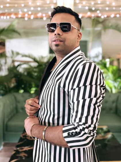 A profile shot in my striped blazer. It's all about confidence and owning your unique style.