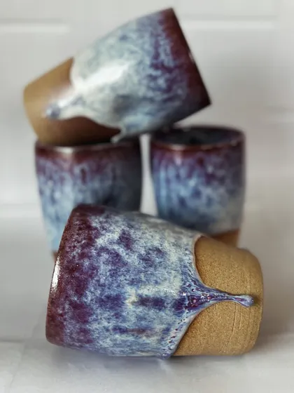 A playful stack of my drip grip tumblers, showing the variations in the glaze drips.