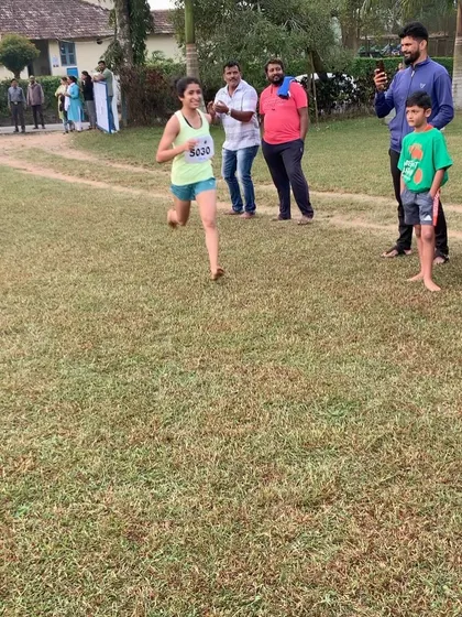 A young participant running with focus and determination. We welcome runners of all ages to join our community.