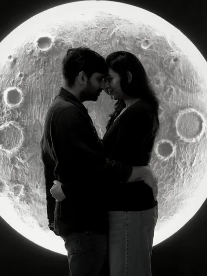 A romantic couple's silhouette against our moon backdrop. This black and white image is perfect for capturing the deep connection and shared dream of the parents-to-be.
