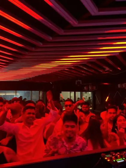 The red lighting at NYX Lounge created an intense and immersive atmosphere for the party.