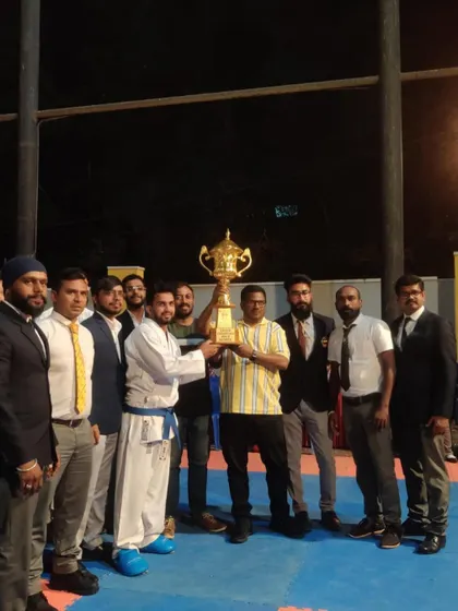 Celebrating the successful completion of our 13th state-level inter-dojo karate championship. Holding this trophy represents the collective effort of our entire team.