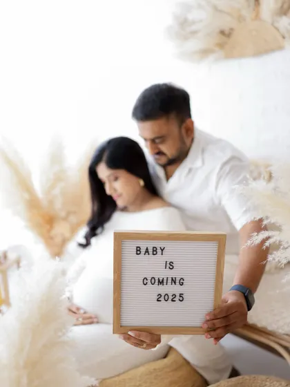 "Baby is coming 2025." A simple and sweet announcement from this couple, captured in a soft and dreamy light.
