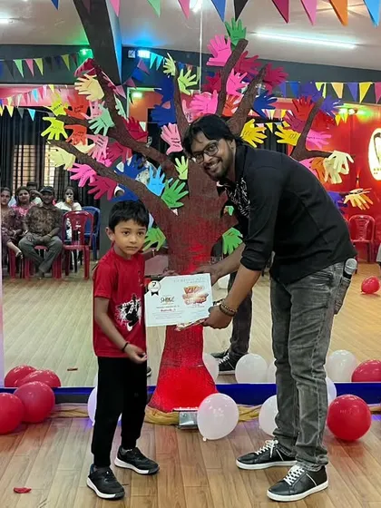 Another happy student receiving his certificate on stage. The joy on their faces is the biggest reward for us as instructors.