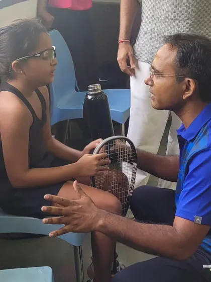Taking a moment between matches at the Gyanshree School tournament to give a young player some tactical advice and encouragement. Mentorship is just as important as technical coaching.