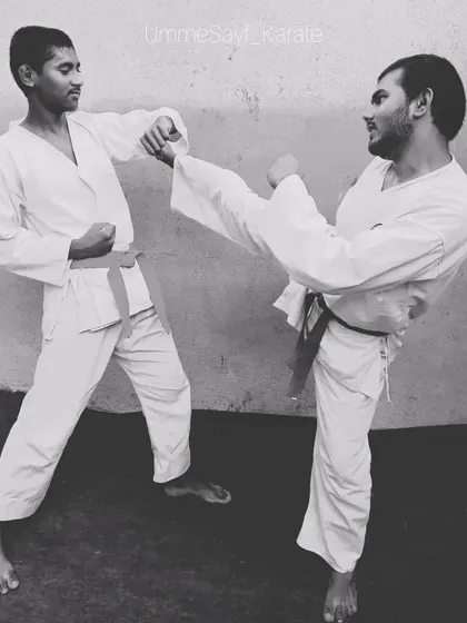 Practice makes you perfect. Two of my senior students sparring, demonstrating a block and a kick with great control. This is what consistent training looks like.