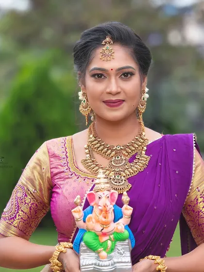 A portrait of the model from the Ganesh Chaturthi shoot, showcasing the intricate details of the antique-finish jewellery.