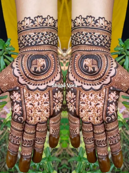 A classic design with a central elephant mandala, perfect for festivals or family functions.